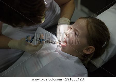 Little Girl At Dentist Office, Getting Local Anesthesia Injection Into Gums, Dentist Numbing Gums Fo