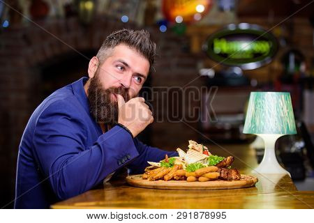 Hipster Hungry Eat Pub Fried Food. Man Received Meal With Fried Potato Fish Sticks Meat. High Calori