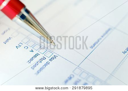 Schengen Visa, Questionnaire. Hand With Pen Completing A Questionary
