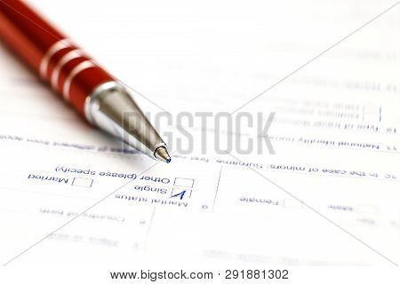Schengen Visa, Questionnaire. Hand With Pen Completing A Questionary