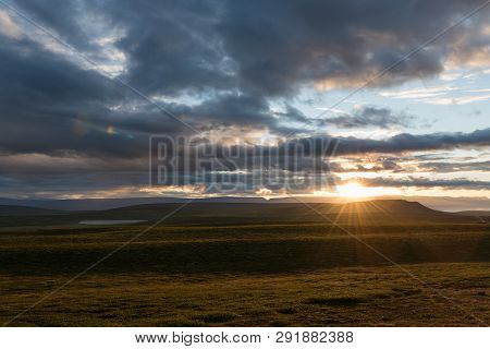 Colorful Sunset Over The Mountains. Fantastic Views Of The Landscape In Iceland.