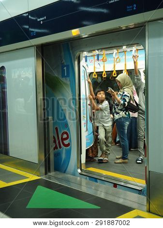 Jakarta, Indonesia - March 23, 2019: People Getting On The Train At Bundaran Hi Mrt Station.