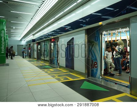 Jakarta, Indonesia - March 23, 2019: People Getting On The Train At Bundaran Hi Mrt Station.