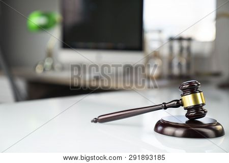 Legal Office Concept. Gavel, Computer, Scale And Hourglass On The White Table.