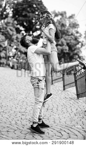 Guy Raising Up Girlfriend. Romantic Date Walk. Happy To See Her. Man Carrying Girlfriend In Hands Wh