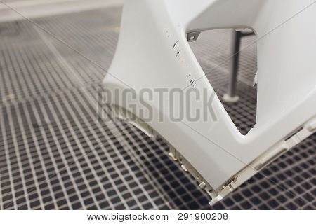 Repair Of The Rear Bumper Of A White Car After An Accident With The Help Of Multi-colored Putty In A