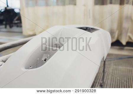Repair Of The Rear Bumper Of A White Car After An Accident With The Help Of Multi-colored Putty In A