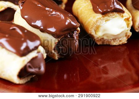 Traditional French Dessert. Eclair With Chocolate Icing. Pastery Concept With Chocolate Eclair