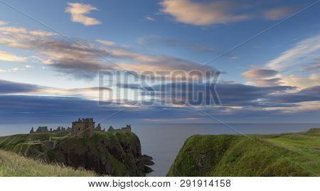 Landscape Of Dunnottar Castle Ruins Withh Dark Clouds And The Ocean
