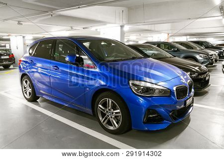 Geneva, Switzerland - March 13, 2019: Blue Motor Car Bmw 2-series Active Tourer (f45) In The Undergr