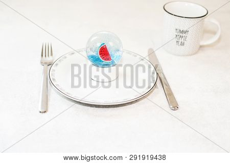 Beautiful Snow Ball With Watermelon And Glitter Inside On White Plate. Christmas On The Beach Concep