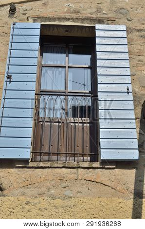 Blue Wooden Shutters On Balcony In Borguetto, A Charming Village  Of The Province Of Verona, Italy.