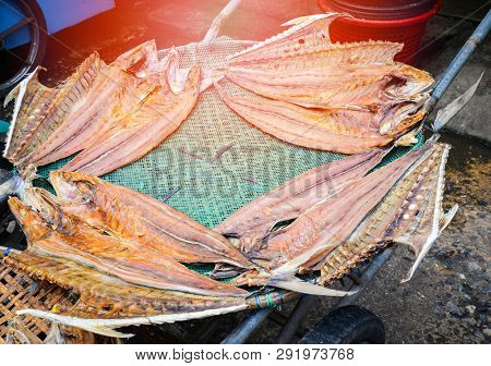 Dried Fish Slide With Salt Traditional On The Bamboo Threshing Basket Drying  With Sunny