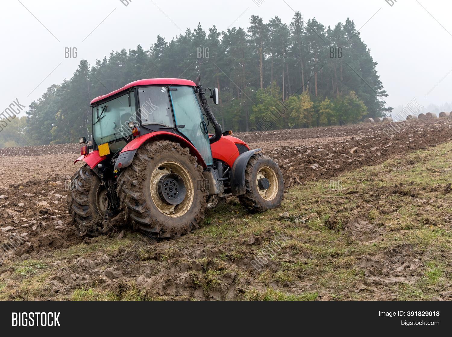 Red Tractor On Muddy Image & Photo (Free Trial) Bigstock
