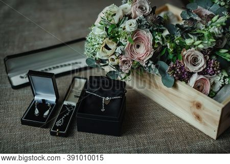 Various Wedding Atributes, Bouquets And Rings And Earings