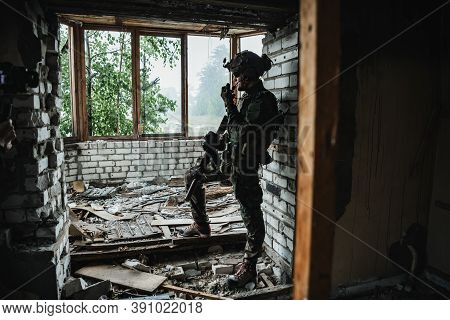 Soldier Talking On The Walkie-talkie Inside The Building, Military Concept