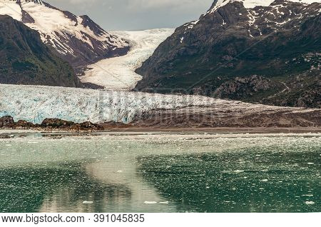 Sarmiento Channel, Chile - December 11, 2008: Amalia Glacier Ending In Greenish Reflecting Water Wit