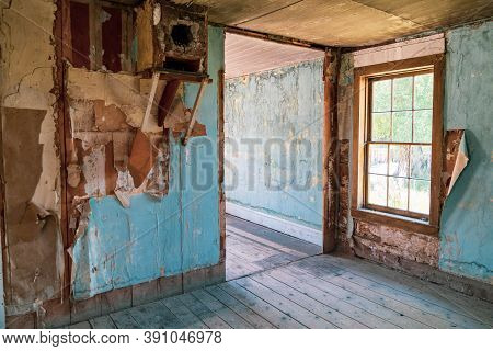 Peeling Paint In A Damaged, Abandoned Home In Bannack Ghost Town In Montana