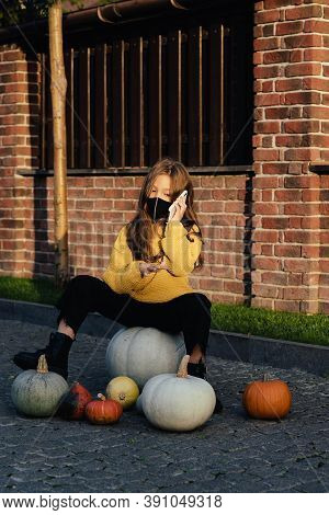Kids Trick Or Treat In Halloween Costume And Face Mask. Coronavirus Halloween. Child Celebrates Holi