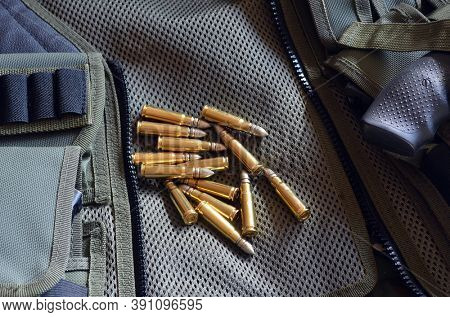 Ammunition 7,62*39.Tactical unloading vest as background. October 23, 2020.Kiev,Ukraine