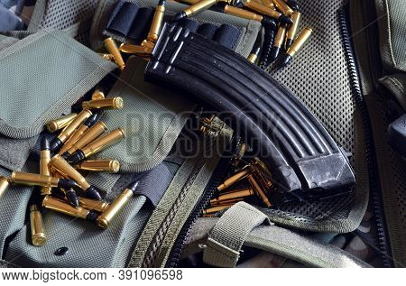 Ammunition 7,62*39.Tactical unloading vest as background. October 23, 2020.Kiev,Ukraine