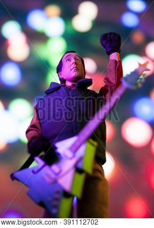 OCT 17 2020 - National Lampoon's Christmas Vacation Clark Griswold with a Christmas Tree guitar and light background - Neca action figure