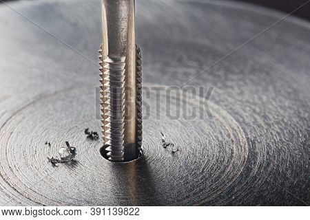 Thread Tap. Tap Drill Steel Billet. Working Cutter.