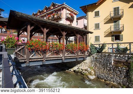 The Typical Wood Bridge With Flowers Simbol Of The Town Of Ponte Di Legno, Brescia Province, Italy.