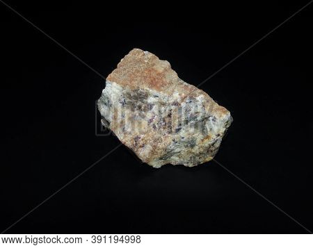 Small Particles Of Cinnabar In The Rock On A Black Background