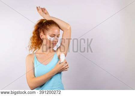 Young Attractive Red-haired Girl With Curly Hair With Antiperspirant And With Patches Under The Eyes