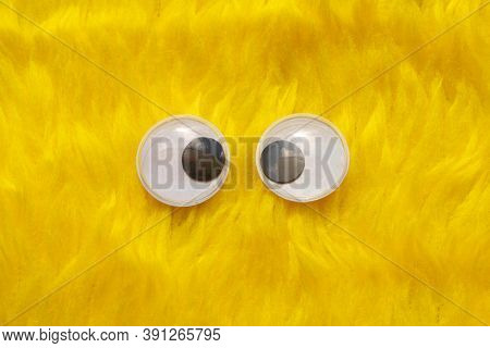 Funny Wiggle Google Eyes On Fabric Silly Fur Carpet Background