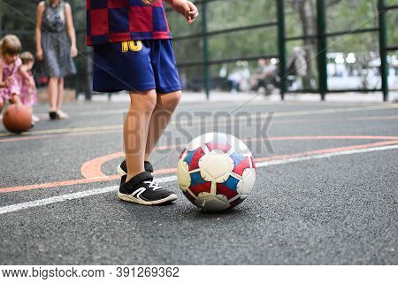 Moscow. Russia. September 2020. Kids Sport Outdoor. Child Plays Yard Football. Amateur Soccer Sport 