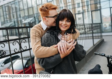 Cute Couple, Man Hugging His Girlfriend From Behind, Buried His Face In Her Hair