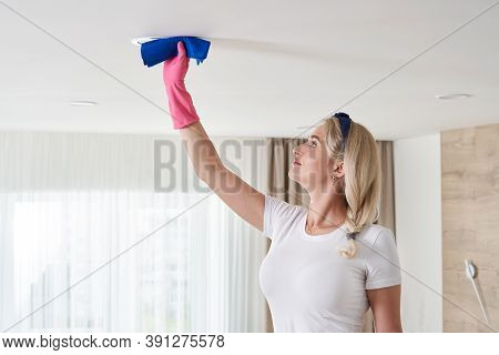 Maid Woman Holding Mop Pile, Cleaning Ceiling In Living Room. House Cleaning Service Concept.