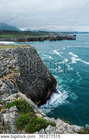 Scenic View Of Cantabrian Sea Coast With Tall Cliffs And Blue Water At Bufones De Pria In Asturias, 