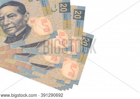 20 Mexican Pesos Bills Lies In Small Bunch Or Pack Isolated On White. Mockup With Copy Space. Busine