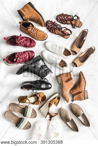Variety Of Women's Fashion Comfortable Shoes Of All Seasons On A Light Background, Top View