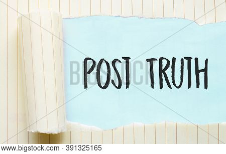 The Text Post Truth Appearing Behind Torn White Paper