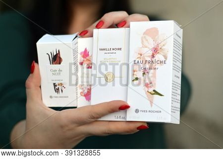 Young Girl Holds Yves Rocher Production In Packages. Yves Rocher Is A Worldwide Cosmetics And Beauty