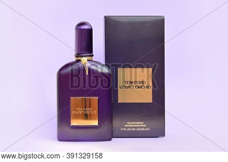 Tom Ford Velvet Orchid Fragrance Perfume Bottle Lies On Light Lilac Background. Tom Ford Is American