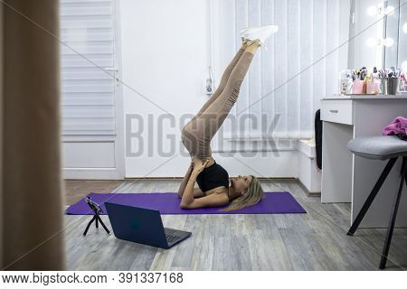 Fitness Yoga coaching working from home - Personal training online stock photo