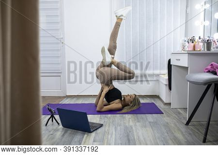 Fitness Yoga coaching working from home - Personal training online stock photo