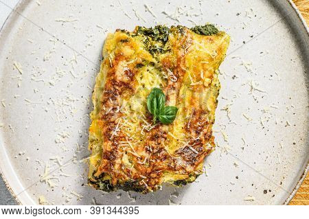 Baked Stuffed Vegetarian Pasta Cannelloni With Broccoli, Spinach, Basil And Cheese. Gray Background.