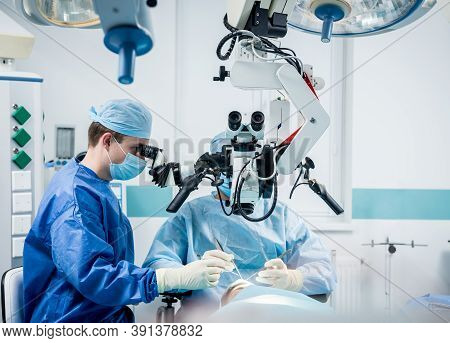 A Team Of Surgeons Performing Brain Surgery To Remove A Tumor.
