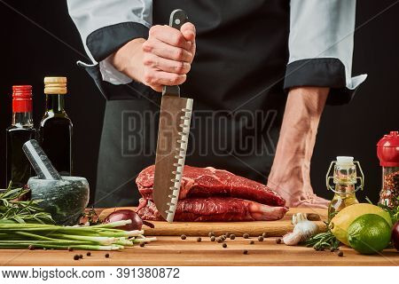Chef Is Ready To Cook A Beef Steak With His Sharp Santoku Knife