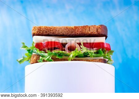 Multilayered Sandwich With Cheese, Pork Balyk, Bell Pepper, Lettuce Leaves And Toasted Bread On The 