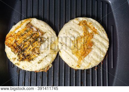 Grilled Haloumi Cheese With Herbs On A Grill Pan. Selective Focus