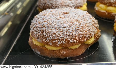 French Fresh Baked Sweet Filled Brioche Pastry Tarte Tropezienne In Confectionery Shop In Saint-trop