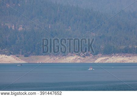 Lost Creek Lake Near Prospect,  Oregon / Usa - September 7, 2014:  A Small Fire Fighting Plane Prepa