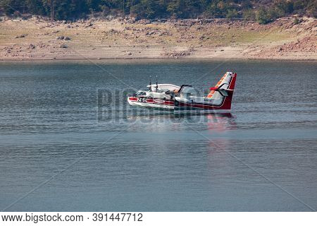 Lost Creek Lake Near Prospect,  Oregon / Usa - September 7, 2014:  A Small Fire Fighting Plane Prepa